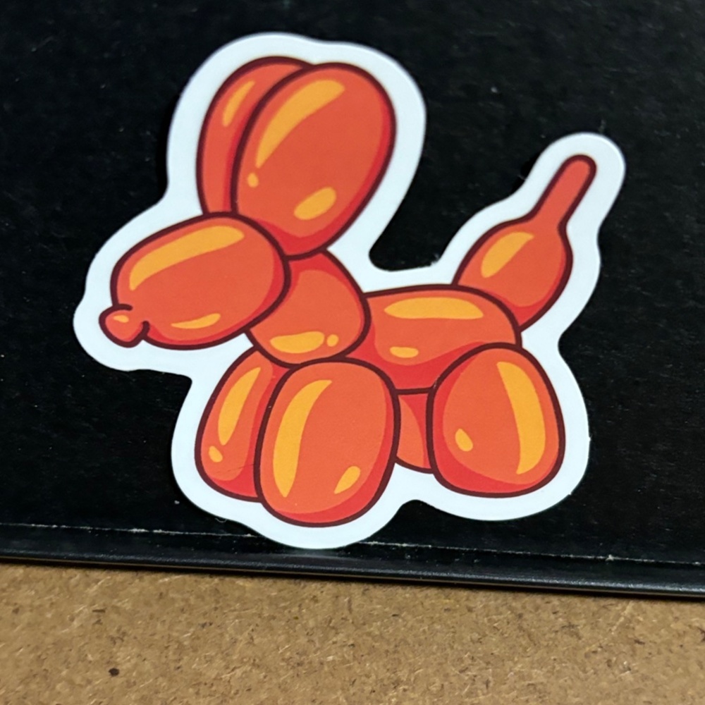 ORANGE BALLOON ANIMAL DOG STICKER